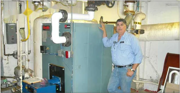 Heidler technician servicing a large commercial boiler in an Annapolis building