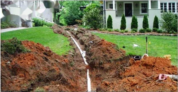 Open trench across an Annapolis lawn during a sewer line replacement