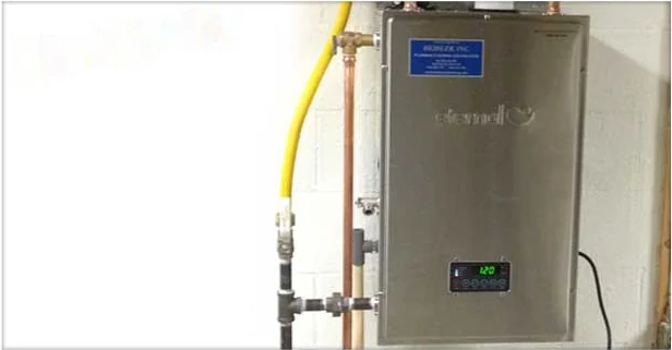 Wall-mounted tankless water heater installed with gas and water connections